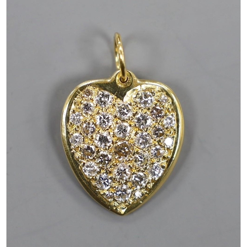 885 - A modern 18ct gold and pave set diamond heart shaped pendant, overall 27mm, gross weight 11.3 grams.... 