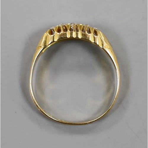 887 - An early 20th century 18ct gold and graduated five stone diamond chip set half hoop ring, size Q, gr... 