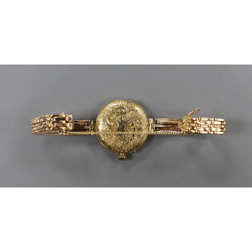 890 - An early 20th century engraved 18ct gold fob watch, now converted to a wrist watch on a later expand... 