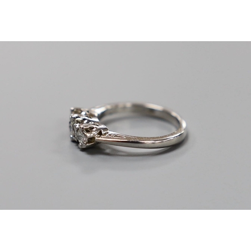 907 - A modern platinum and three stone diamond ring, size H, gross weight 4.8 grams.