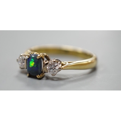 908 - A modern 18ct gold, black opal and diamond set three stone ring, size Q, gross weight 4.6 grams, the... 