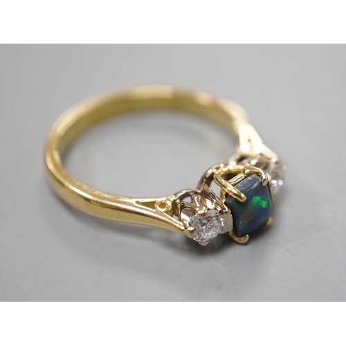 908 - A modern 18ct gold, black opal and diamond set three stone ring, size Q, gross weight 4.6 grams, the... 