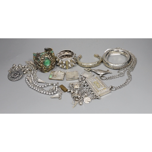 917 - A small group of Middle Eastern mainly white metal jewellery, including bangles, bracelets and an Om... 