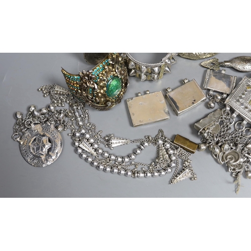 917 - A small group of Middle Eastern mainly white metal jewellery, including bangles, bracelets and an Om... 