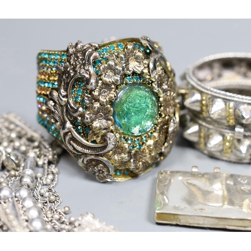 917 - A small group of Middle Eastern mainly white metal jewellery, including bangles, bracelets and an Om... 