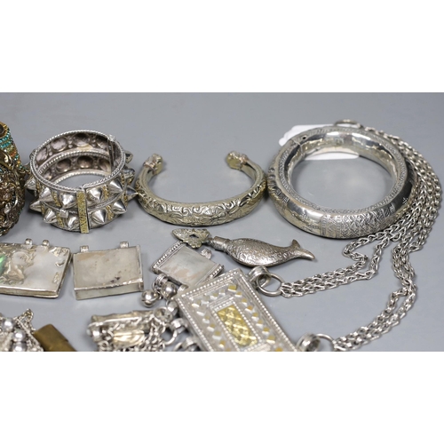 917 - A small group of Middle Eastern mainly white metal jewellery, including bangles, bracelets and an Om... 