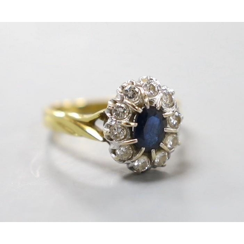 948 - A modern 18ct gold, sapphire and diamond set oval cluster ring, size L, gross weight 4.6 grams.... 