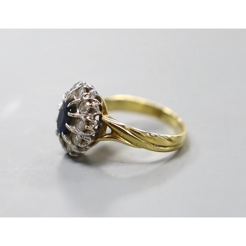 948 - A modern 18ct gold, sapphire and diamond set oval cluster ring, size L, gross weight 4.6 grams.... 