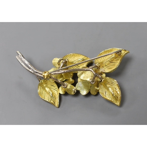 950 - A 1960's two colour 18ct gold and diamond chip set floral spray brooch, maker CJ Ltd, 62mm, gross we... 