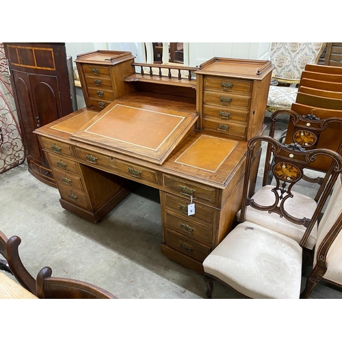 99 - A late Victorian mahogany pedestal desk with hinged slant front, width 137cm, depth 73cm, height 113... 