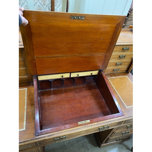 99 - A late Victorian mahogany pedestal desk with hinged slant front, width 137cm, depth 73cm, height 113... 