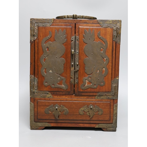 427 - A Chinese brass mounted two door, five drawer cabinet,29 cms high,