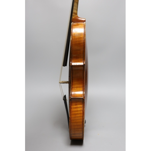 431 - An early 20th century cased violin, length of back 36 cm