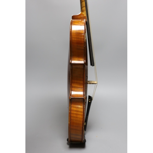 431 - An early 20th century cased violin, length of back 36 cm