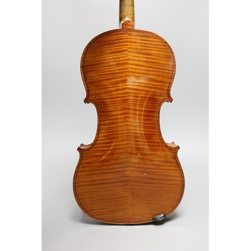 431 - An early 20th century cased violin, length of back 36 cm