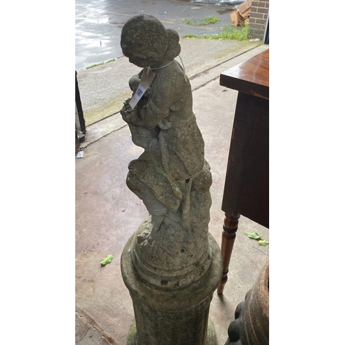 1001 - A reconstituted stone garden statue on plinth, overall 109cm