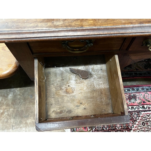 1006 - A Regency mahogany kneehole dressing table and a George III banded oak chest of three drawers, width... 