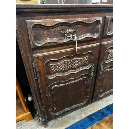 1013 - An 18th century French Provincial oak buffet, lacking two feet, width 171cm depth 48cm height 110cm... 