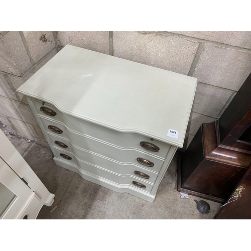 1021 - An eau de nil painted chest with brushing slide and four drawers, width 76cm