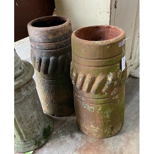 1026 - A pair of Victorian terracotta chimney pots, height 63cm