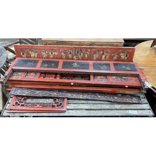 1028 - Nine sections of a Chinese red lacquered cabinet, with gilt figural decoration