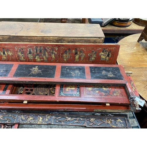 1028 - Nine sections of a Chinese red lacquered cabinet, with gilt figural decoration