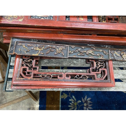 1028 - Nine sections of a Chinese red lacquered cabinet, with gilt figural decoration