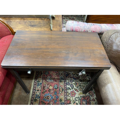 1036 - A Continental mahogany folding and extending dining table, with three extra leaves, width 97cm... 