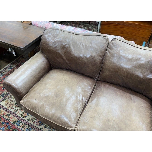 1037 - A Laura Ashley brown leather upholstered two seater settee, width 172cm