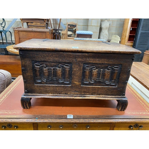 1038 - A small 1920's linenfold carved coffer, width 81cm