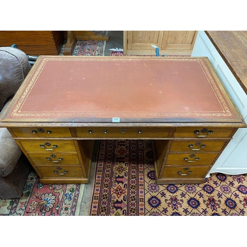 1039 - An Edwardian oak pedestal desk, width 138cm