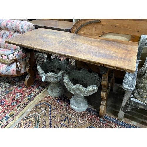 1043 - A Spanish walnut centre table, with wrought iron stretcher, width 151cm depth 69cm height 75cm... 