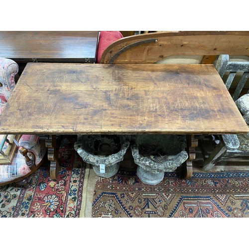 1043 - A Spanish walnut centre table, with wrought iron stretcher, width 151cm depth 69cm height 75cm... 