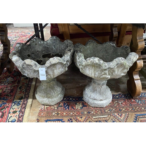 1044 - A pair of reconstituted stone garden planters, width 44cm height 48cm