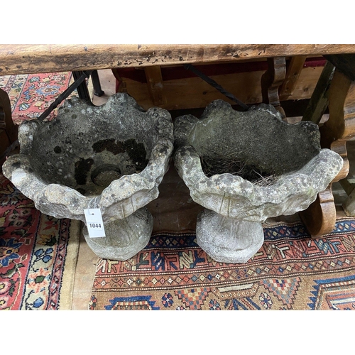 1044 - A pair of reconstituted stone garden planters, width 44cm height 48cm