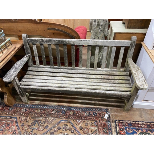 1046 - A weathered teak garden bench, width 162cm