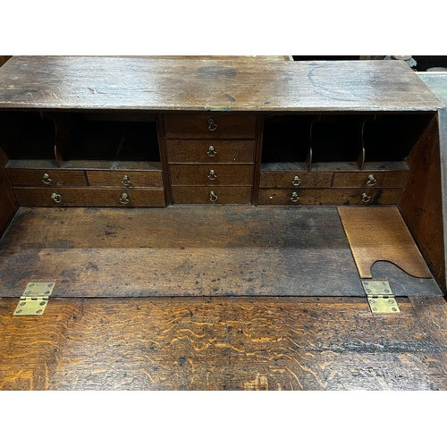 1052 - A George III oak bureau, width 91cm depth 50cm height 102cm