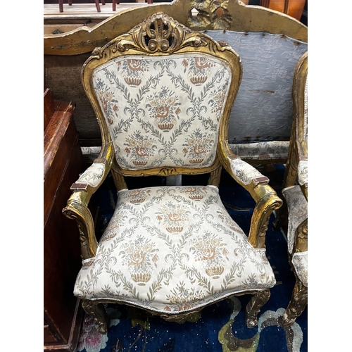 1056 - A Louis XV style giltwood and gesso three piece salon suite