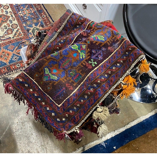 1068 - A group of assorted Caucasian saddlebags and other small rugs