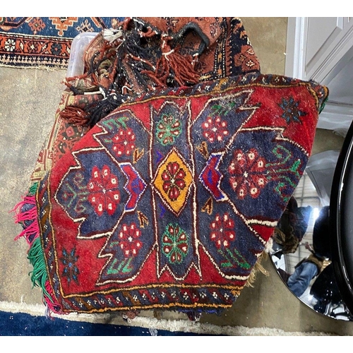 1068 - A group of assorted Caucasian saddlebags and other small rugs