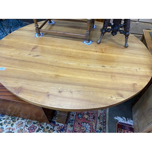 1080 - A 'Woodpecker Man' adzed oak dining table, with oval top and chip carved underframe, 170cm x 146cm... 