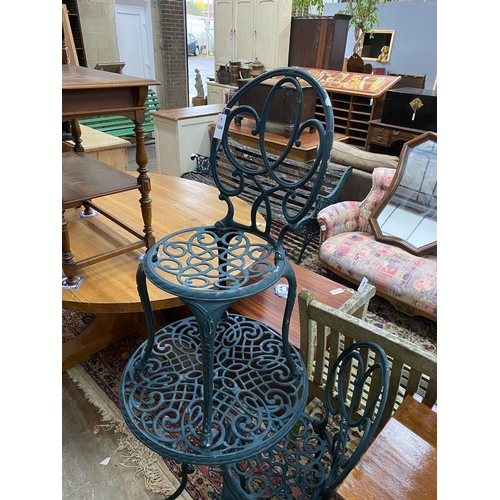 1088 - A green painted aluminium cafe table and two chairs