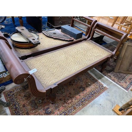 1097 - An Asian hardwood day bed with cane seat, length 210cm