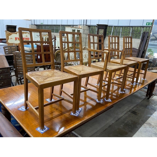 1100 - A set of five Heals Cotswold oak dining chairs, including one carver