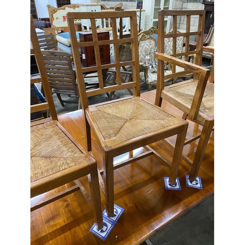 1100 - A set of five Heals Cotswold oak dining chairs, including one carver