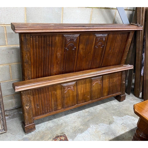 1103 - An Indonesian hardwood bedstead, width 182cm