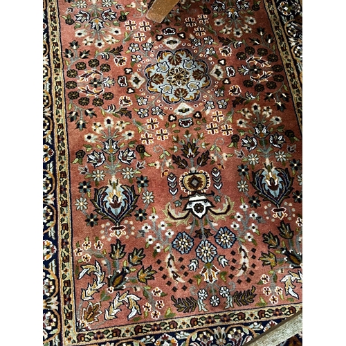 1107 - A North West Persian peach ground rug, 160 x 93cm