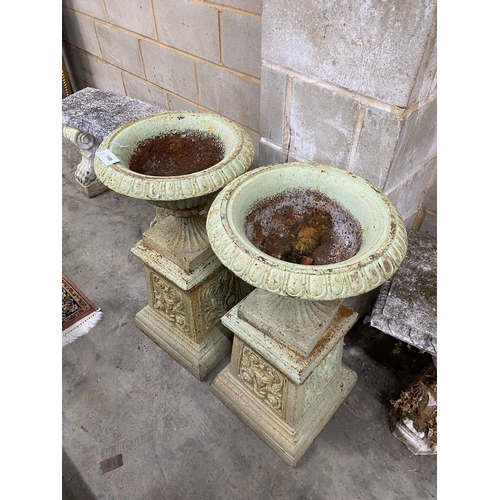 1109 - A pair of Victorian cast iron garden urns and pedestals, diameter 43cm height 80cm