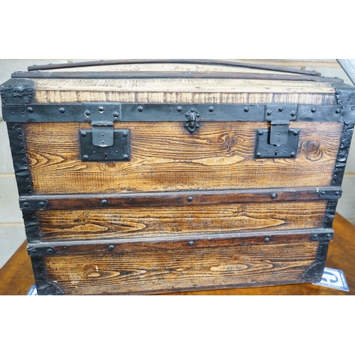 1114 - A metal bound domed top steamer trunk, 57 cm high, 76 cm wide, 49 cm