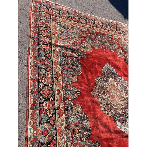 1120 - A large North West Persian red ground carpet, 361cm x 274cm